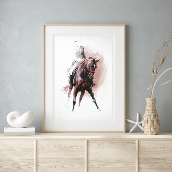 Bay dressage horse print in a light wood frame on cabinet